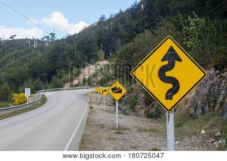road signs on the carretera austral on a sunny day