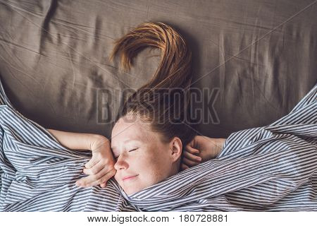 Beautiful Young Woman Lying Down In Bed And Sleeping, Top View. Do Not Get Enough Sleep Concept