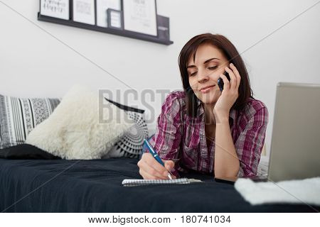 Young freelancer woman using laptop.Happy smiling girl working on line.Work at home.Studying and learning using notebook computer.Enjoy working.Freelance workbusiness people concept.Home office