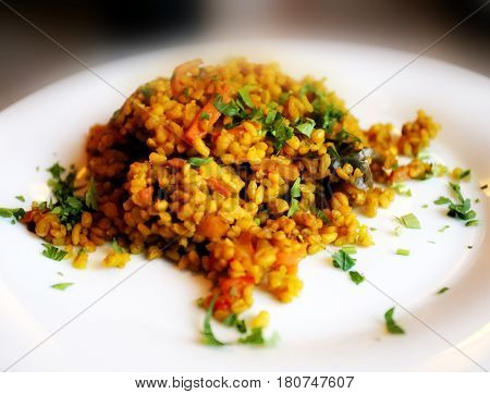 Delicious porridge bulgur photographed in close up