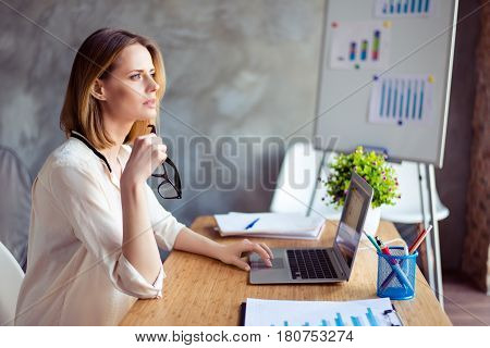Young Cute Woman With Glasses Dreaming And Resting While Sitting At Table In Workplase