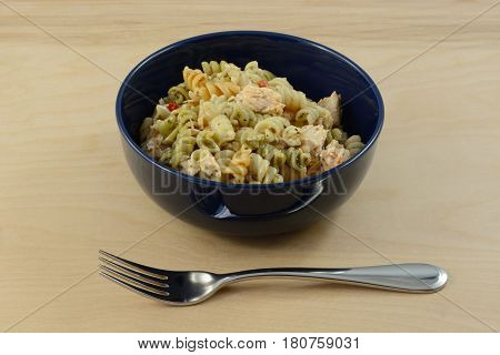 Salmon fillet pasta salad with rotini vegetable pasta in bowl