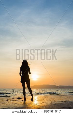 Woman on the beach in Ao Nang Krabi at sunset