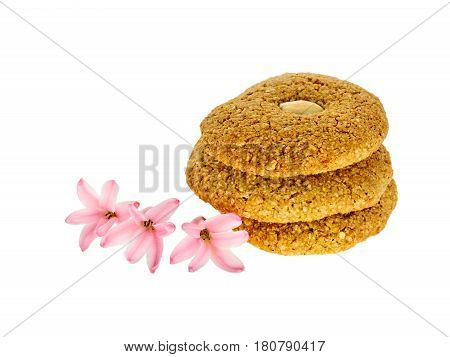 Almond cookies isolated on white with hiacintus flowers
