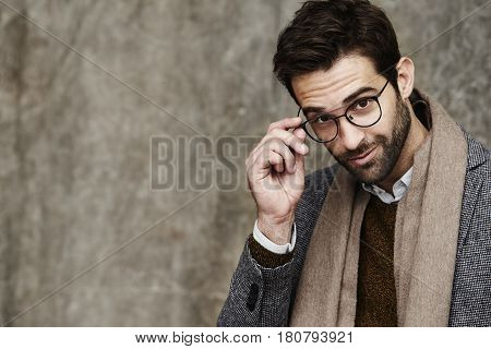 Handsome Bookish boy looking at camera studio