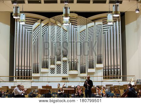 CRACOW POLAND - SEPTEMBER 25 2015: View of the stage of the concert hall at the Cracow Philharmonic with the new Orgelbau organ in the background. Cracow Poland
