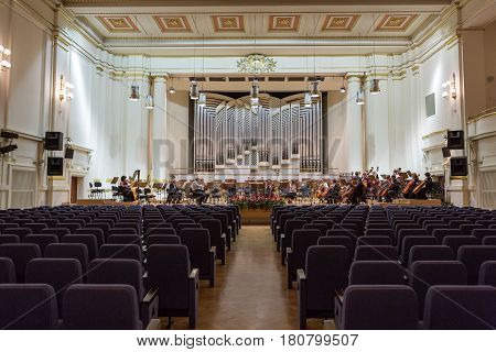 CRACOW POLAND - SEPTEMBER 25 2015: View of the stage of the concert hall at the Cracow Philharmonic with the new Orgelbau organ in the background. Cracow Poland