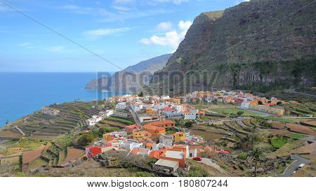 AGULO, LA GOMERA, SPAIN: General view of the village with terraced fields and cliffs in the background