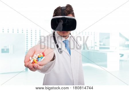 Modern Medic Holding Pills And Vitamins In Hand