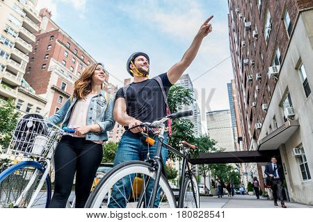 Couple of cyclist in New York - Couple of lovers sighseeing Manhattan on bikes
