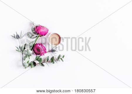 Modern spring design with bright pink flowers and coffee on white desk background top view moke up