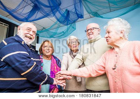 Senior adults in a nursing home for the elderly doing leisure activities