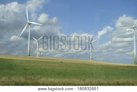Windmills for electric power production Sudetenland. Windmills. Summer.