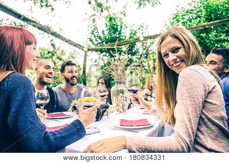 Group of friends at restaurant outdoors - People having dinner in a home garden