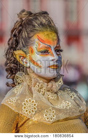 TIMISOARA ROMANIA - APRIL 1 2017: Living statue of a woman multicolor dressed and present on the street inside the CheckART Carnival organized by the City Hall Timisoara. Union Square.