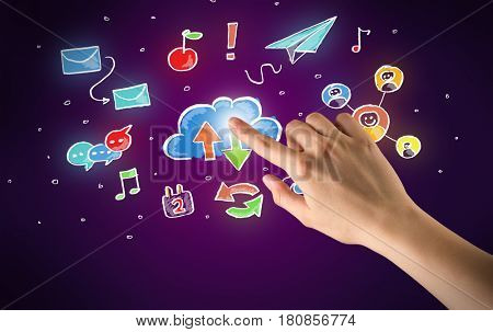 Female hand toucing mixed media icons with purple background