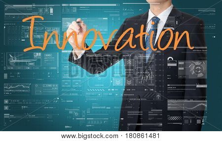 Businessman Writing Innovation And Drawing Graphs And Diagrams