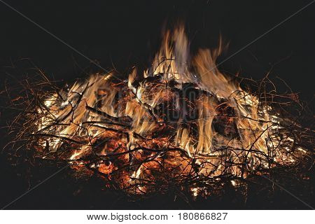 A close up of the aflame big bonfire.