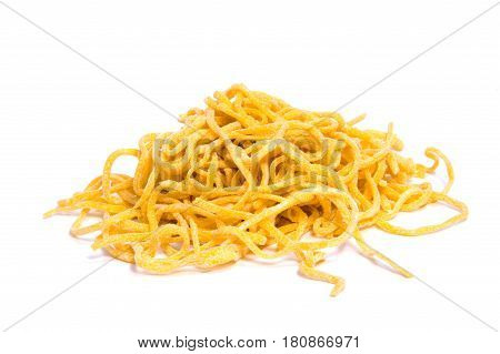 A lot of pasta. Dry pasta. Scattered pasta. Pasta background. Pasta in form of shells. Macaroni products. Macaroni background. Food background.