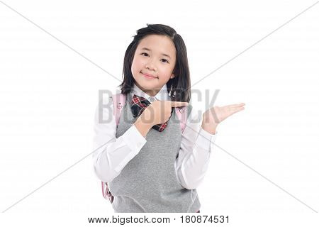 Asian student pointing to open hand palm on white background isolated