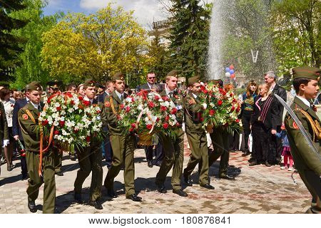 PYATIGORSK RUSSIA - MAY 09 2011: Military solders lay flowers to the monument to the fallen soldiers of Second World War