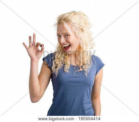 Girl showing OK sign with hand and smiling