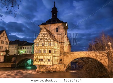 Famous Bamberg Town Hall With Regnitz River At Night, Bavaria, Germany