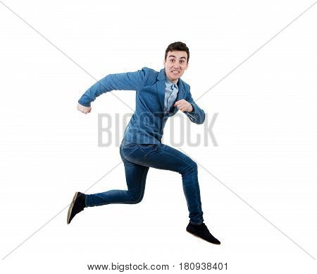 Businessman running and jumping over obstacle with a fearful expression.
