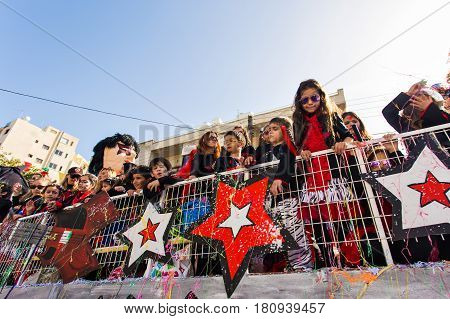 LIMASSOL, CYPRUS - FEBRUARY 26: Grand Carnival Parade - an unidentified people of all ages , gender and nationality in colorful costumes during the street carnival, February 26, 2017 in Limassol, Cyprus.