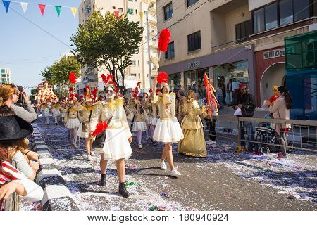LIMASSOL, CYPRUS - FEBRUARY 26: Grand Carnival Parade - an unidentified people of all ages , gender and nationality in colorful costumes during the street carnival, February 26, 2017 in Limassol, Cyprus.