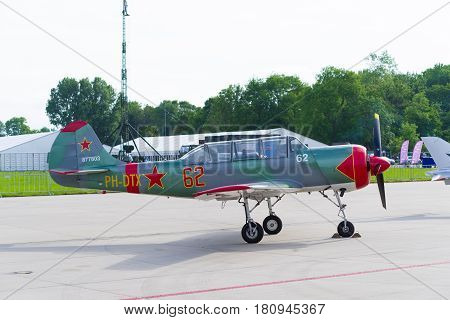 LEEUWARDEN NETHERLANDS - JUNE 10 2016: parked Yak-52 at the dutch air force open days
