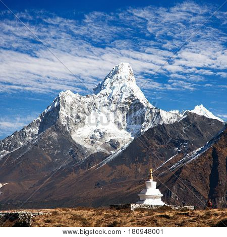 Mount Ama Dablam with stupa near Pangboche village and beautiful cloudy sky - way to mount Everest base camp - Khumbu valley - Nepal
