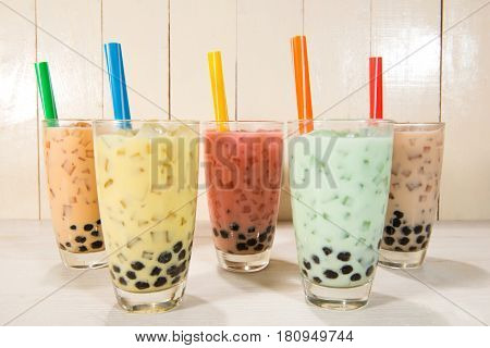 Boba / Bubble tea. Homemade Various Milk Tea with Pearls on wooden table.