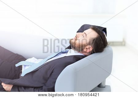 Satisfied businessman relaxing in his modern office