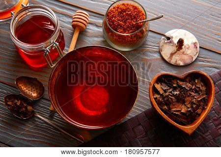 Bancha tea served in golden bowl on wooden table board
