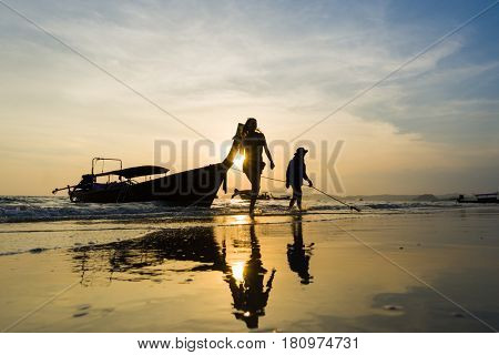 Ao Nang Krabi Thailand - March 03 2017: People on the Ao Nang beach at sunset in Krabi province Thailand