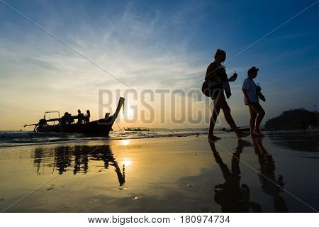Ao Nang Krabi Thailand - March 03 2017: People on the Ao Nang beach at sunset in Krabi province Thailand