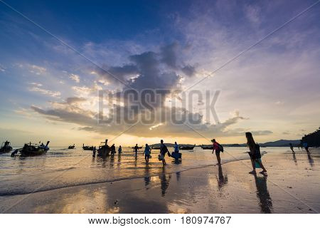 Ao Nang Krabi Thailand - March 02 2017: People on the Ao Nang beach at sunset in Krabi province Thailand