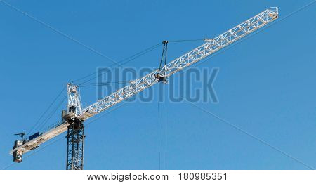 Building crane lifting material at a construction site