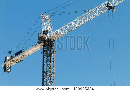 Building crane lifting material at a construction site