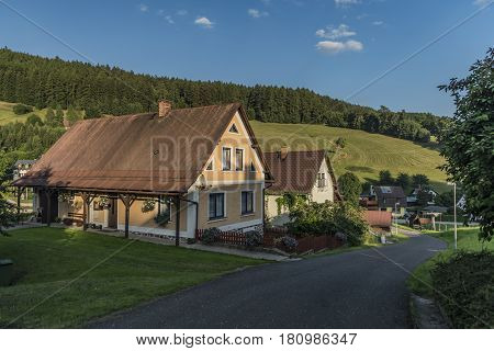 Sunny Summer Day In Krkonose Mountains With Countryside House