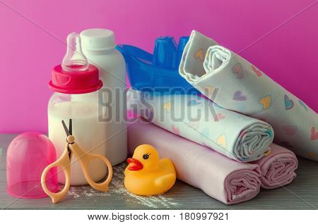 accessories for baby diapers on white background, banny, a bottle of water, cream