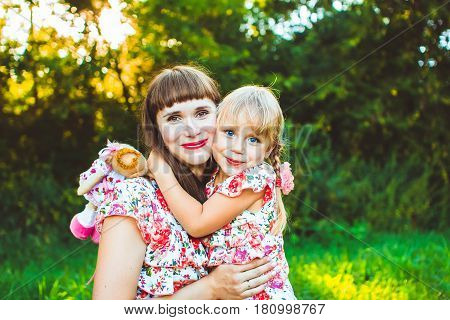 Mother and daughter. nature in profile looking at each other