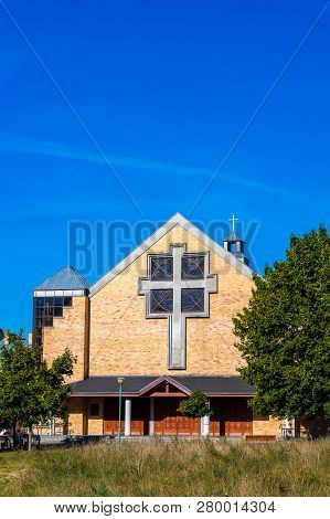 Poznan, Poland - September 16, 2018: Church With Cross Symbol By Trees And Grass At The Orla Bialego