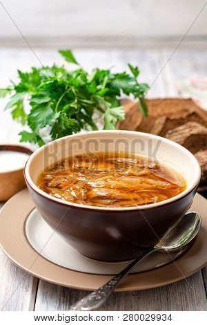 Traditional Russian Sauerkraut Soup Shchi In Bowl On Rustic Wooden Background