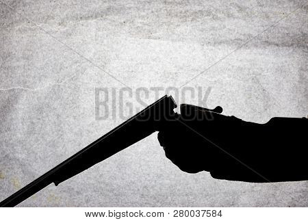 Classic Double-barrell Smooth-bore Hunting Rifle On Man Hand Isolated On Light Stone Background