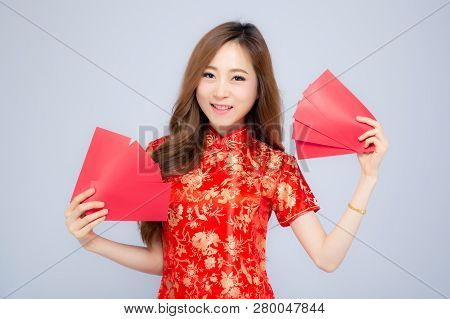 Beautiful Portrait Young Asian Woman Cheongsam Dress Smiling Holding Red Envelope On White Backgroun
