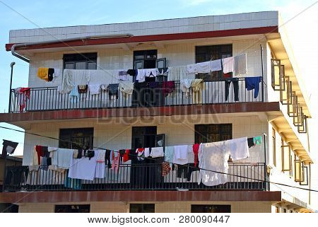 Laudry Hangs To Dry On The Balconies Of An Apartment Building In Kampala, Uganda.