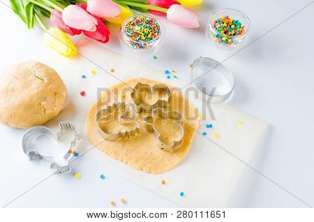 Easter Cooking Background, Dough And Indredients, Cuts For Cookies And Colored Sugar Décor For Bakin