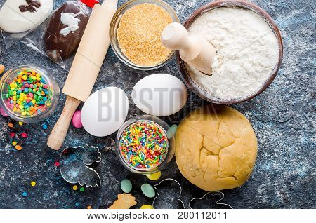 Easter Cooking Background, Dough And Indredients, Cuts For Cookies And Colored Sugar Décor For Bakin